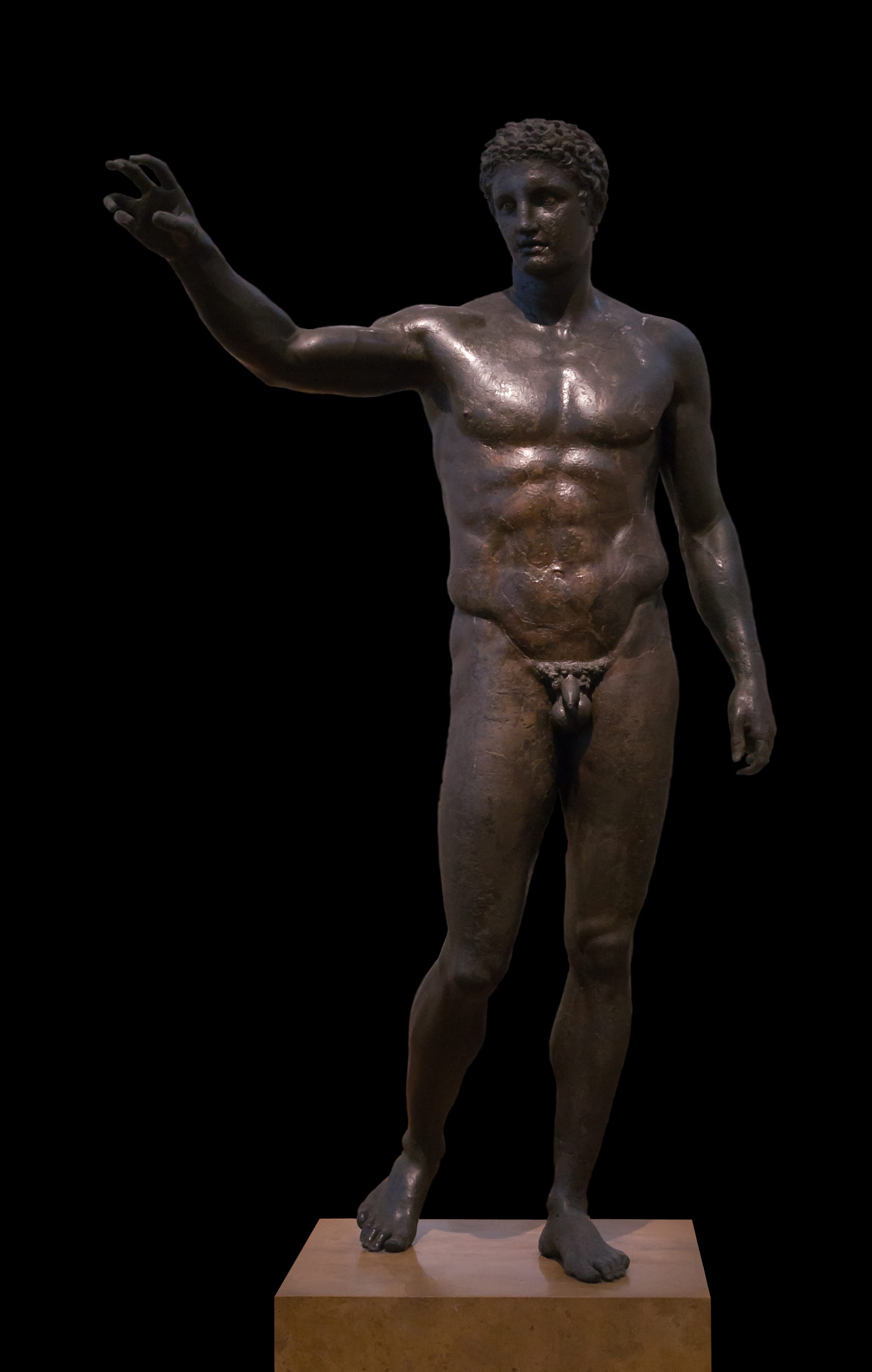 The Antikythera Youth (Ephebe) marble statue, full-length, in a museum gallery setting